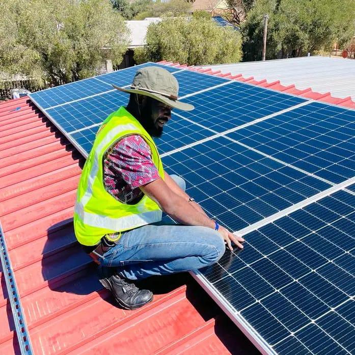GreenTech installation team working on solar panels